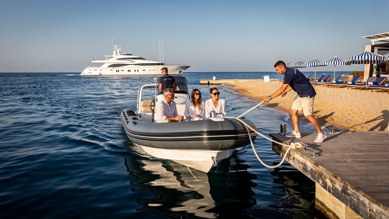 Luxury yacht tender arriving at Pampelonne beach club jetty